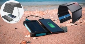 Top 5 solar USB chargers for 2025 displayed with travel gear, showing lightweight foldable panels and power banks charging a phone under sunlight